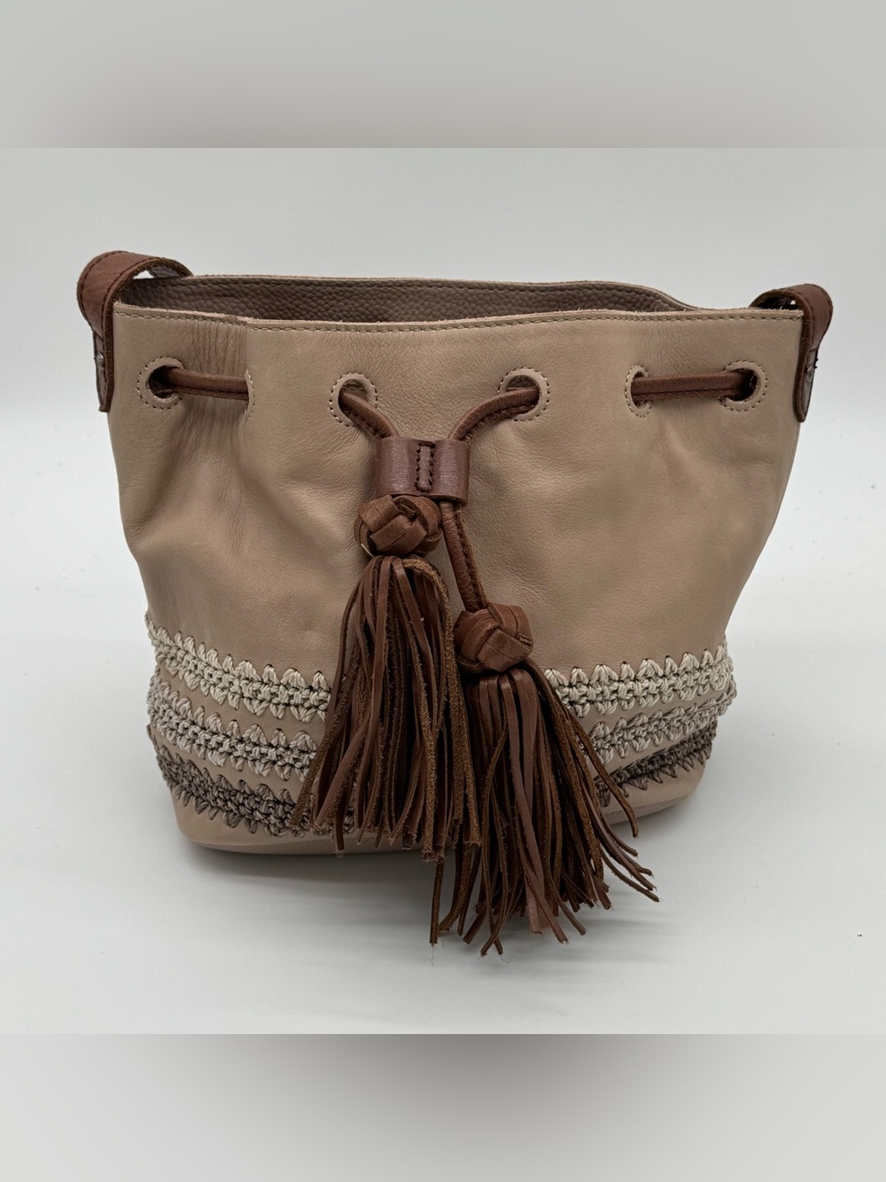The Sak Medium Bucket Drawstring Bag Striped Crochet Tassel Strap